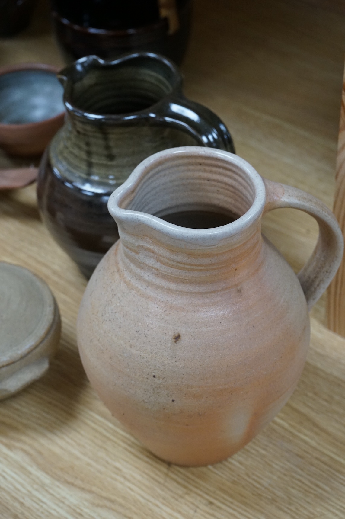 A large group of 20th century signed and unsigned Studio pottery, tallest 23cm high
